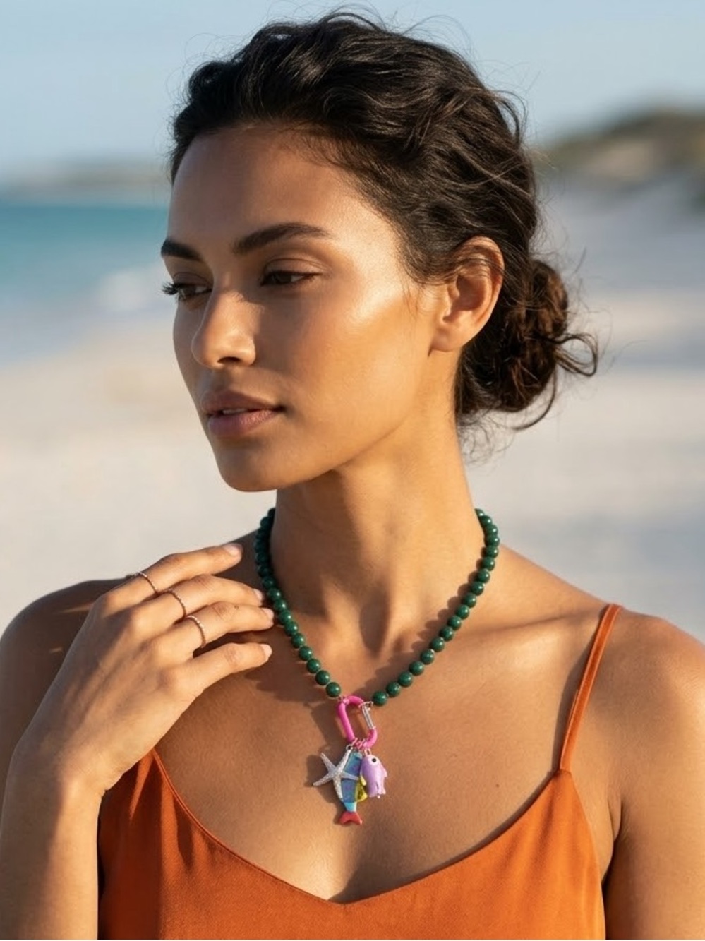 Green Beaded Necklace with Colorful Charms